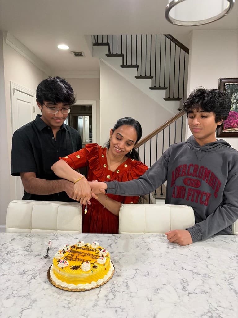 Sudhith Mannuru celebrating a birthday with Sravani Mannuru and Mokshith Mannuru.